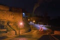 Scenic early winter morning landscape view of old winding cobble stone road between ancient buildings. Royalty Free Stock Photo