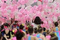 children catch balloons falling from the ceiling, cheerleaders have fun after the competition