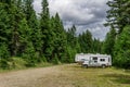 KAMLOOPS, CANADA - JULY 9, 2020: Classic Travel Trailer and truck at camping site Paul Lake