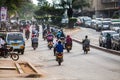 Motorbike taxis on a wide avenue in the capital city, Kampala, Uganda. Royalty Free Stock Photo