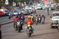 Motorbike taxis on a wide avenue in the capital city, Kampala, Uganda. Royalty Free Stock Photo