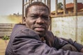 Portrait of a middle-aged black man. Worker truck in a dirty jacket