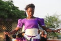 African singer sings and dances at a street event in Kampala