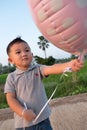 KAMPHAENG PHET, THAILAND - OCTOBER 26 : Happy Baby play with balloons on OCTOBER 26, 2015 Kamphaeng Phet, Thailand