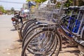 Kampot, Cambodia - 12 April 2018: city bicycles for rent concept, empty street on background. Modern urban bicycle