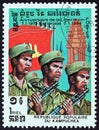 KAMPUCHEA - CIRCA 1984: A stamp printed in Kampuchea shows soldiers, National Flag, Independence Monument, circa 1984.