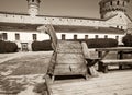 Kamyanets-Podilsky citadel tourism museum, Ukraine. 12 may 2023. Old wooden horse for punishment in the courtyard of the castle Royalty Free Stock Photo