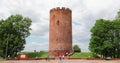 Kamyenyets, Brest Region, Belarus. People Walking Near Tower Of Kamyenyets In Summer Day