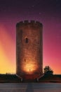 Kamyenyets, Brest Region, Belarus. View Of Tower Of Kamyenyets In Evening Time. Sunset Dramatic Sky. Soft Light Pink