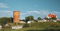 Kamyenyets, Brest Region, Belarus. Tower Of Kamyenyets In Sunny Summer Day With Green Grass In Foreground