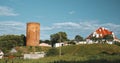 Kamyenyets, Brest Region, Belarus. View Of Tower Of Kamyenyets In Sunny Summer Day With Green Grass In Foreground. Set