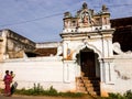 The arched entrance doorway of an old heritage palace in the village of Athangudi