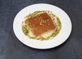 Kanafeh arabic dessert with green almonds Royalty Free Stock Photo