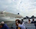 Tourists on pleasure boat. Big cruise ship. Osanbashi pier at the port of Yokohama Royalty Free Stock Photo