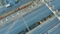 Kanash, Russia - January 7, 2019: Flying over the railroad tracks with a locomotive and wagons. Winter. Aerial , copter