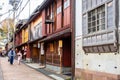 Higashi Chaya Geisha district with old wooden houses and tourists walking dressed in traditional japanese kimonos, Kanazawa,Japan Royalty Free Stock Photo