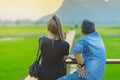 KANCHANABURI THAILAND - April 10 : Unidentified couple sit for resting and waiting for time to take photos of the sunset on April