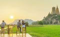 KANCHANABURI THAILAND - April 10 : Unidentified couple sit for resting and waiting for time to take photos of the sunset on April