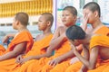 KANCHANABURI-THAILAND, APRIL 17,2019: Unidentified novices sit and wait for the water pouring ceremony on the Songkran festival at