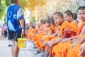 KANCHANABURI-THAILAND, APRIL 17,2019: Unidentified novices sit and wait for the water pouring ceremony on the Songkran festival at