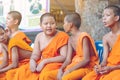 KANCHANABURI-THAILAND, APRIL 17,2019: Unidentified novices sit and wait for the water pouring ceremony on the Songkran festival at