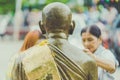 KANCHANABURI THAILAND - APRIL 17 : Unidentified people Shower the monk sculpture in Songkran festival on April 17,2018 at Wat