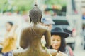 KANCHANABURI THAILAND - APRIL 17 : Unidentified people Shower the monk sculpture in Songkran festival on April 17,2018 at Wat