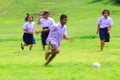 KANCHANABURI, Thailand -AUGUST 25, 2017: Slow motion of the Thai student playing football on green field in the school