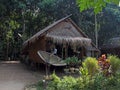 Reed hut with satellite antenna of the people of the mon tribe among the jungles of Thailand