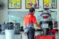 KANCHANABURI-THAILAND, JULY 20 ,2023 : Yamaha motorcycle authorized workshop and sales center. Technician repairs yamaha