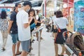 KANCHANABURI,THAILAND-JUNE 20,2020: Unidentified customers choose to order food from menu in front of the restaurant before into