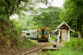 Vintage train stops at the station of the Death railway in Kanchanaburi, Thailand.