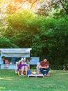 KANCHANABURI THAILAND - MAY 4,2020 : Unidentified Thai couple come to visit and sitting on deck chairs to relax and use