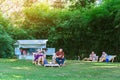 KANCHANABURI THAILAND - MAY 4,2020 : Unidentified Thai couple come to visit and sitting on deck chairs to relax and use