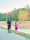 KANCHANABURI/THAILAND-MAY 7,2020 : Unidentified Thai sportive people jogging for good health on road beside irrigation canal at