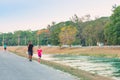 KANCHANABURI/THAILAND-MAY 7,2020 : Unidentified Thai sportive people jogging for good health on road beside irrigation canal at