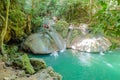 Unacquainted Tourist Playing natural water fall slider in erawan waterfall natiaonal park kanchanaburi Royalty Free Stock Photo