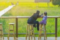 KANCHANABURI THAILAND - November 1 : Unidentified Mom and daughter sit for resting and waiting for time to take photos of the