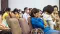 KANCHANABURI-THAILAND,SEPTEMBER 12 ,2020 : Unidentified senior woman covers her face with her hand to take a nap while listen to