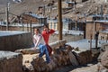 Two Iranian girls playing on the street in rock village Kandovan. Iran Royalty Free Stock Photo