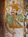 Asian king on old fresco of ancient Buddhist temple