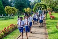 KANDY, SRI LANKA - JULY 18, 2016: Group o students visit beautiful Peradeniya Royal Botanical Gardens near Kandy, Sri