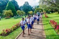 KANDY, SRI LANKA - JULY 18, 2016: Group o students visit beautiful Peradeniya Royal Botanical Gardens near Kandy, Sri