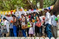 KANDY, SRI LANKA - JULY 19, 2016: White clothed buddhist pilgrims visit Wel Bodiya with Bodhi tree during Poya Full Moon