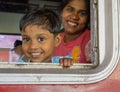 Kandy, Sri Lanka - 09-03-24 - Mother and Child Look Out of Train Window