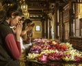 Kandy, Sri Lanka - 09-03-24 - People Place Flowers on Dais and Then Pray to Hindu Gods