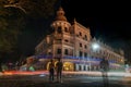 Kandy sri lanka queen`s  hotel at night with traffic light trails and a police man in the middle of the street Royalty Free Stock Photo