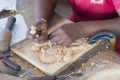 Kandy, Sri Lanka: 03/18/2019: Skilled wood carver hand crafting carvings for the tourist souvenirs