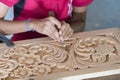 Kandy, Sri Lanka: 03/18/2019: Skilled wood carver hand crafting carvings for the tourist souvenirs