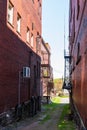 Kane, Pennsylvania, USA May 9, 2023 A walkway between two buildings, both with metal fire escapes